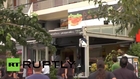 Greece: Athens protesters besiege gunman in cafe