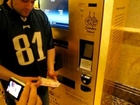Buying gold in a vending machine in Abu Dhabi at Emirates palace!