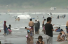 Japanese Seek Relief from Heat at Beaches Near Fukushima Disaster